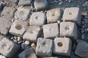 huge cubes on the bank of the river