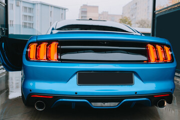 Clean blue sports car rear view