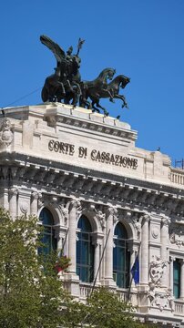 Vertical: The Palazzaccio, or Court of Cassation, rises over the Lungotevere in this majestic urban view, revealing the grandeur of Roman justice architecture