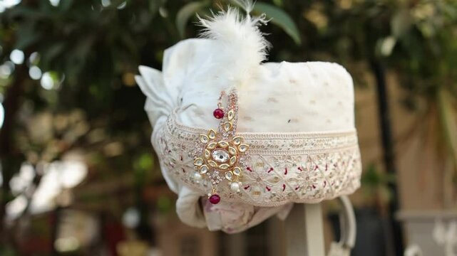 Indian Groom Wedding Dress | Traditional wedding dress and accessories of Indian Groom like Safa or Turban and Pearl necklace Close up Slow Motion