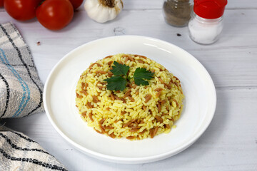 Şehriyeli safranlı pirinç pilavı -Traditional Turkish food, saffron rice pilaf on a white...