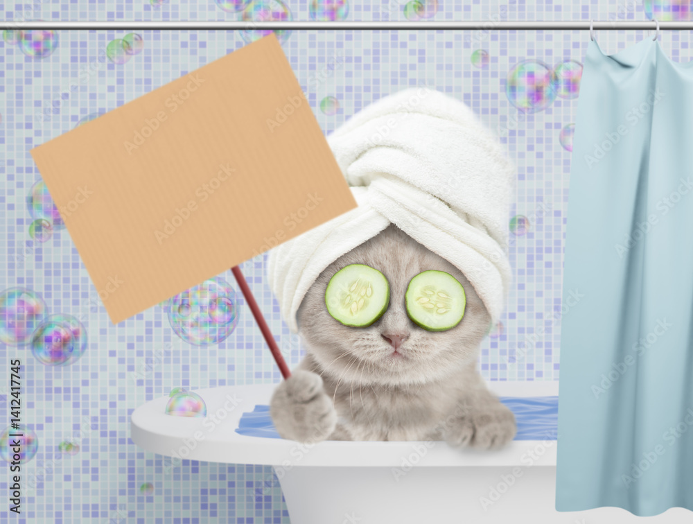 Poster cute kitten with towel on it head and slices of cucumber on it eyes takes the bath at home and shows