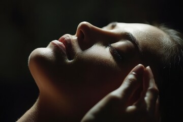 Naklejka premium A spa salon is where a young woman goes to receive a calming and relaxing facial massage treatment