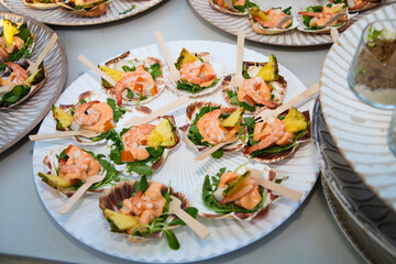 Oyster canape with prawns, pink sauce and pineapple to serve in a catering event.