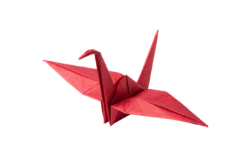A precisely folded red origami crane with sharp wings and neatly creased paper structure on display, isolated on a transparent background