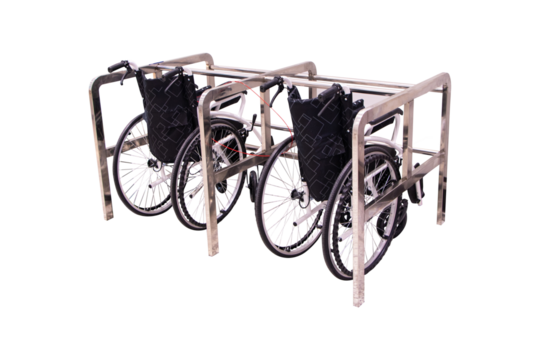 Empty wheelchair black Located in aluminum structure at airport isolated on cut out PNG or transparent background. Devices help disabled people or patients with physical movement problems.
