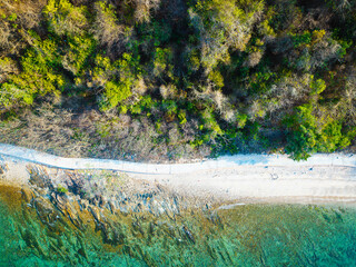 Aerial view white sand beach wave tropical island turquoise water