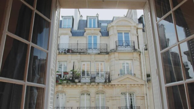 Windows opening on a parisian facade
