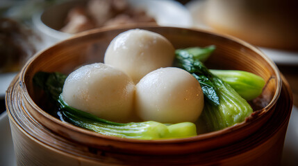 Mouthwatering Steamed Dace Fish Balls Served with Fresh Bok Choy in a Bamboo Basket for a Culinary Delight