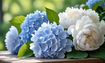 Elegant hydrangeas and peonies arrangement on rustic table with natural green background