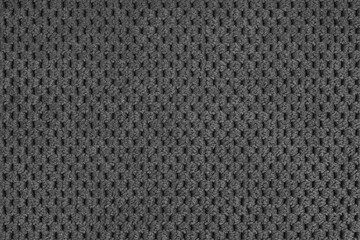 Plain black velour upholstery fabric, fleecy jacquard with macro, closr up pattern weave texture background, cloth textile surface. Wallpaper, backdrop with copy space