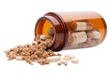 Brown bottle with vitamins spilling out on a white background