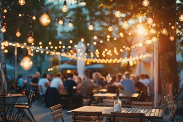 Elegant outdoor networking event with string lights illuminating
