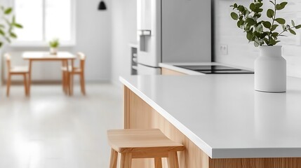 Fototapeta premium Bright, clean kitchen with wood accents and white countertops. Focus on island countertop