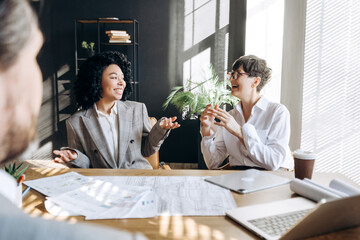Businesswomen discussing sitting at table during office meeting