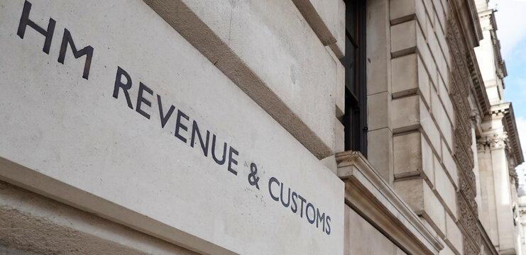HM Revenue & Customs sign on the wall of a government building in Whitehall, Westminster, London, UK.