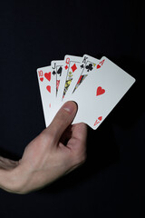 playing cards in a person's hands . gambling