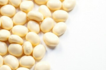 Scattered white beans on pure white background, simple, photography