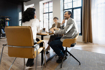 Diverse Team Engaging in Creative Meeting Discussion