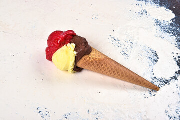 Ice cream cone in Italy chocolate cream and strawberry isolated on a light background