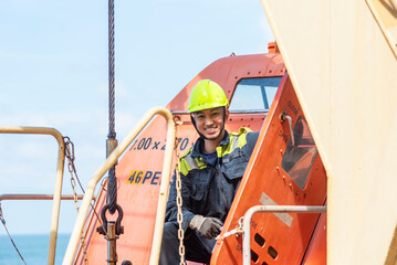 Portrait of the young Filipino officer, fully focused on his task during the inspection of the...