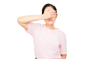 Asian woman in a pink shirt covers her eyes with one hand, conveying a sense of shyness or hiding.