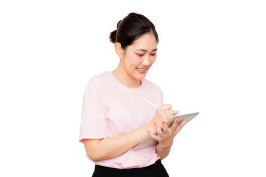 Asian young woman smiles while using a digital tablet and stylus, engaged in creative work or note-taking.