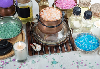 Spa items are arranged in a composition on a table.
