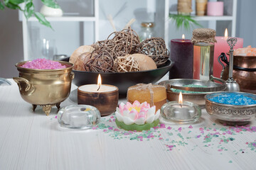 Spa items are arranged in a composition on a table.