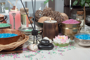 Spa massage items are arranged in a composition on the table.