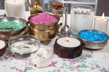 Spa items are arranged in a composition on a table.