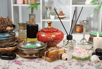 Spa massage items are arranged in a composition on the table.