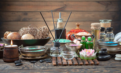 Spa massage items are arranged in a composition on the table.