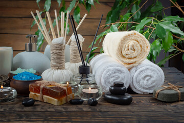 Spa items are arranged in a composition on a table.