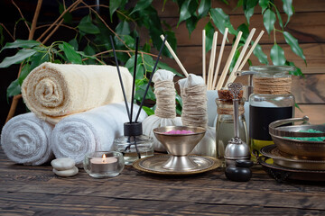 Spa massage items are arranged in a composition on the table.