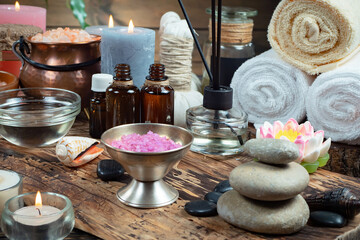 Spa massage items are arranged in a composition on the table.