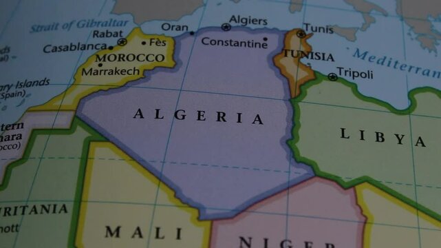 close up of the country of Algeria viewed on a wold map as a travel concept. Algeria on a map. Political map of Algeria 
