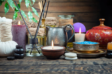 Spa massage items are arranged in a composition on the table.