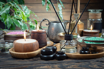 Spa massage items are arranged in a composition on the table.