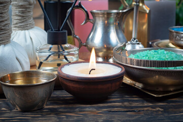 Spa massage items are arranged in a composition on the table.