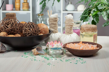 Spa items are arranged in a composition on a table.