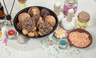 Spa massage items are arranged in a composition on the table.