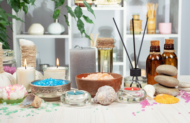 Spa items are arranged in a composition on a table.