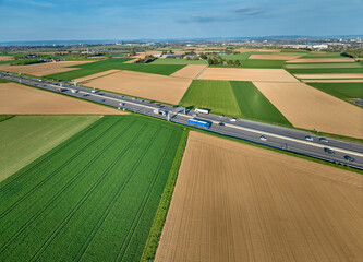 German highway A 81crossing the fertile agricultural landscape of Langes Feld north of Stuttgart, Baden-Wuerttemberg, Germany
