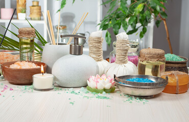 Spa massage items are arranged in a composition on the table.