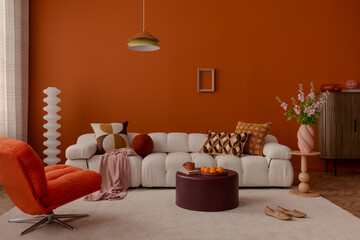 Modern set up of interior design with white modular sofa, orange armchair and stylist decorations. Home decor.