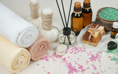 Spa massage items are arranged in a composition on the table.