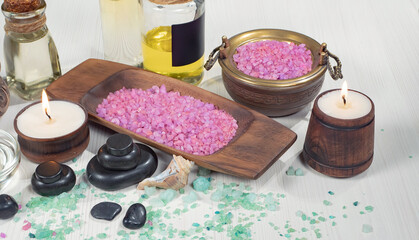Spa treatment with candles and towel on wooden table, closeup