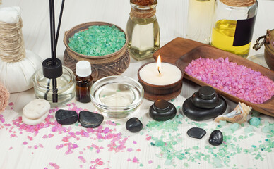 Spa items are arranged in a composition on a table.