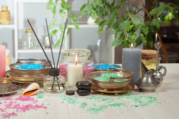 Spa massage items are arranged in a composition on the table.